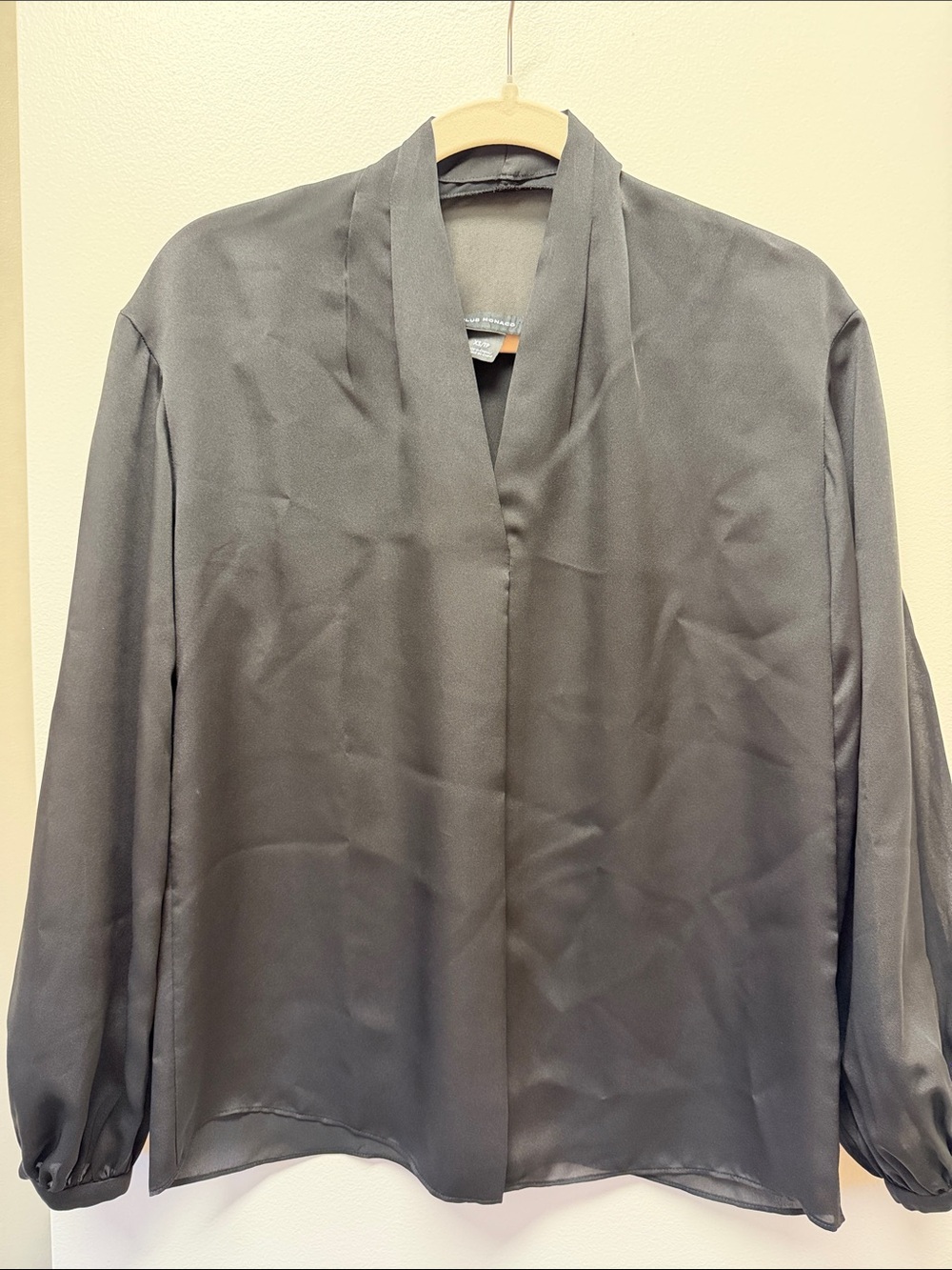 Club Monaco dark gray V-neck blouse with a draped shawl collar and long sleeves.